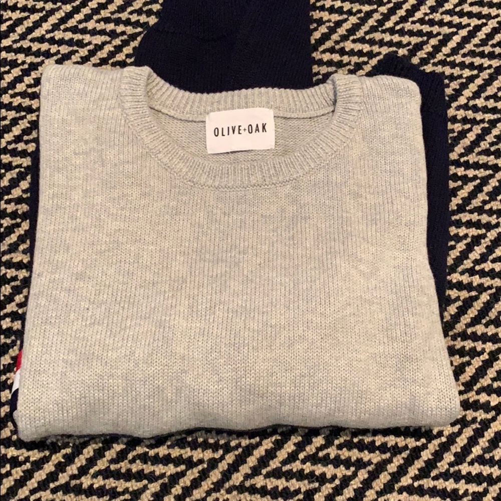 a grey and navy sweater